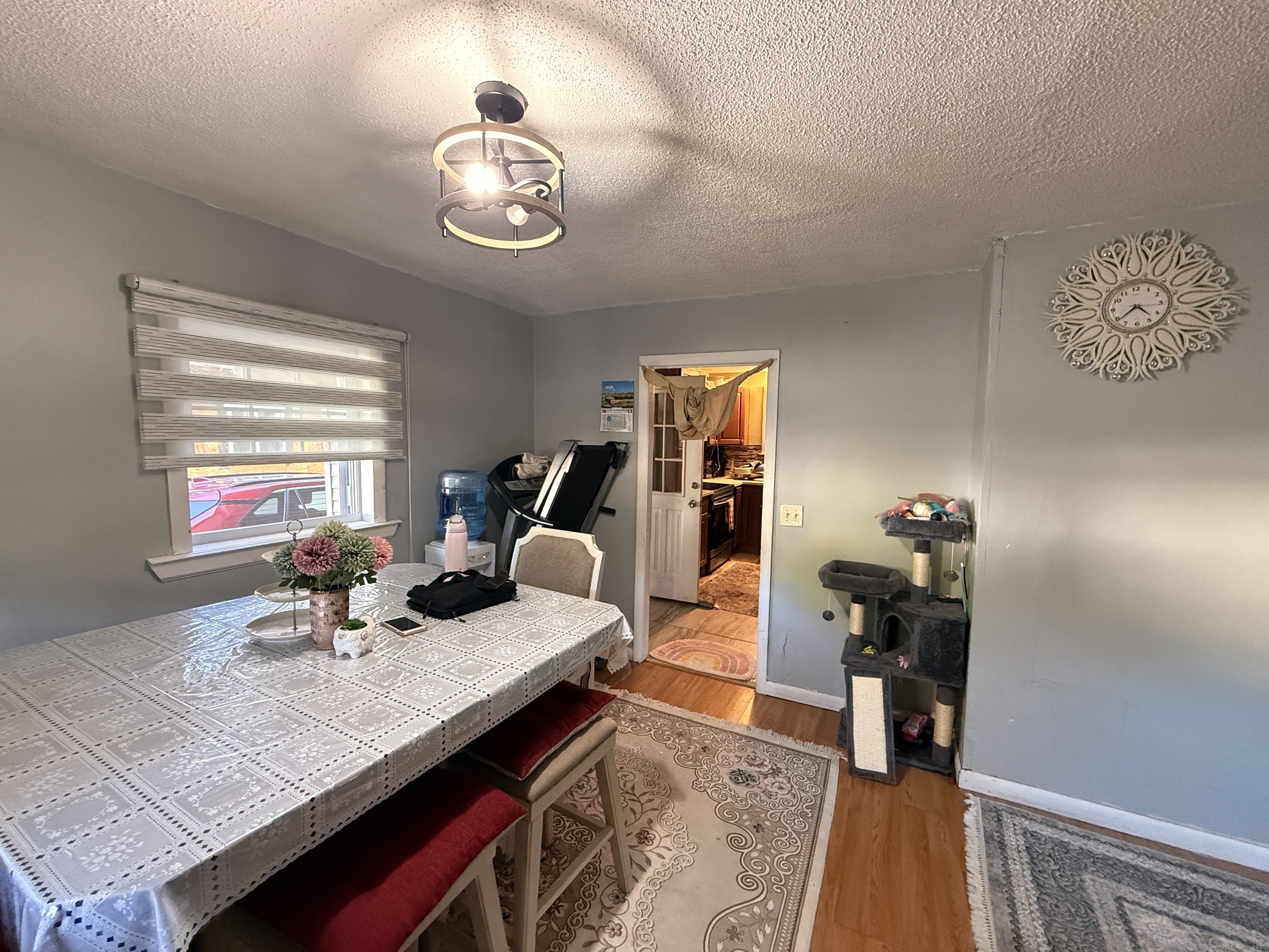 158 East Main Street Bristol, CT 06010 - Photo 9 of 19 a living room with furniture and wooden floor
