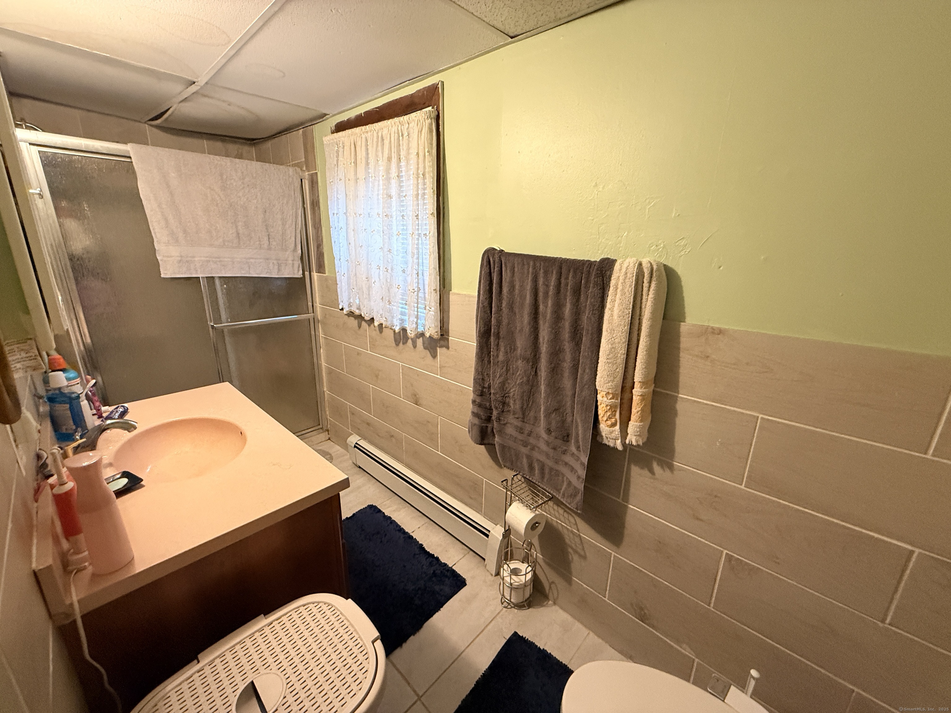 158 East Main Street Bristol, CT 06010 - Photo 10 of 19 a bathroom with a sink mirror vanity and toilet