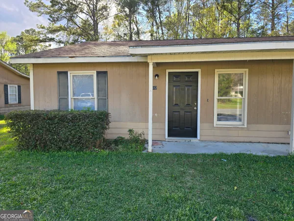 front view of a house with a small yard