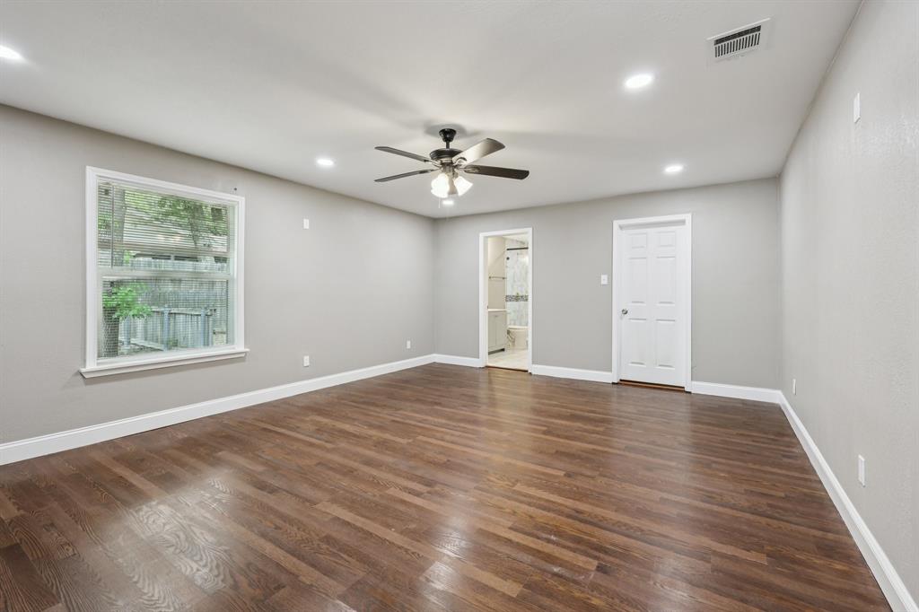 1033 Oak Ridge Drive Azle, TX 76020 - Photo 18 of 30 wooden floor in an empty room with a window