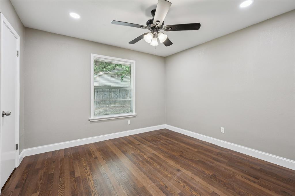1033 Oak Ridge Drive Azle, TX 76020 - Photo 20 of 30 wooden floor in an empty room with a window