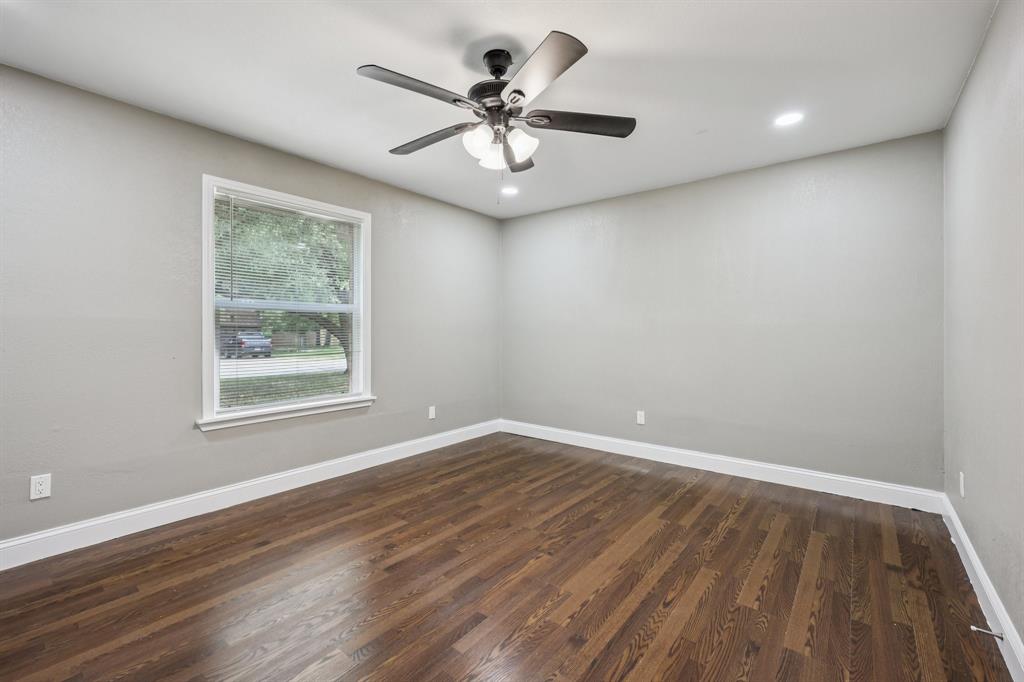 1033 Oak Ridge Drive Azle, TX 76020 - Photo 23 of 30 wooden floor in an empty room with a window