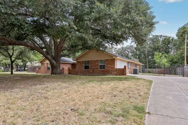 a house with trees in the background
