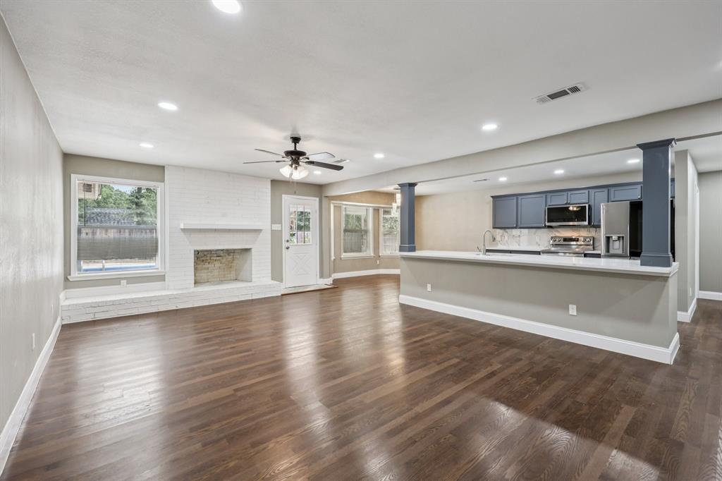 1033 Oak Ridge Drive Azle, TX 76020 - Photo 6 of 30 a view of an empty room with a kitchen and a window