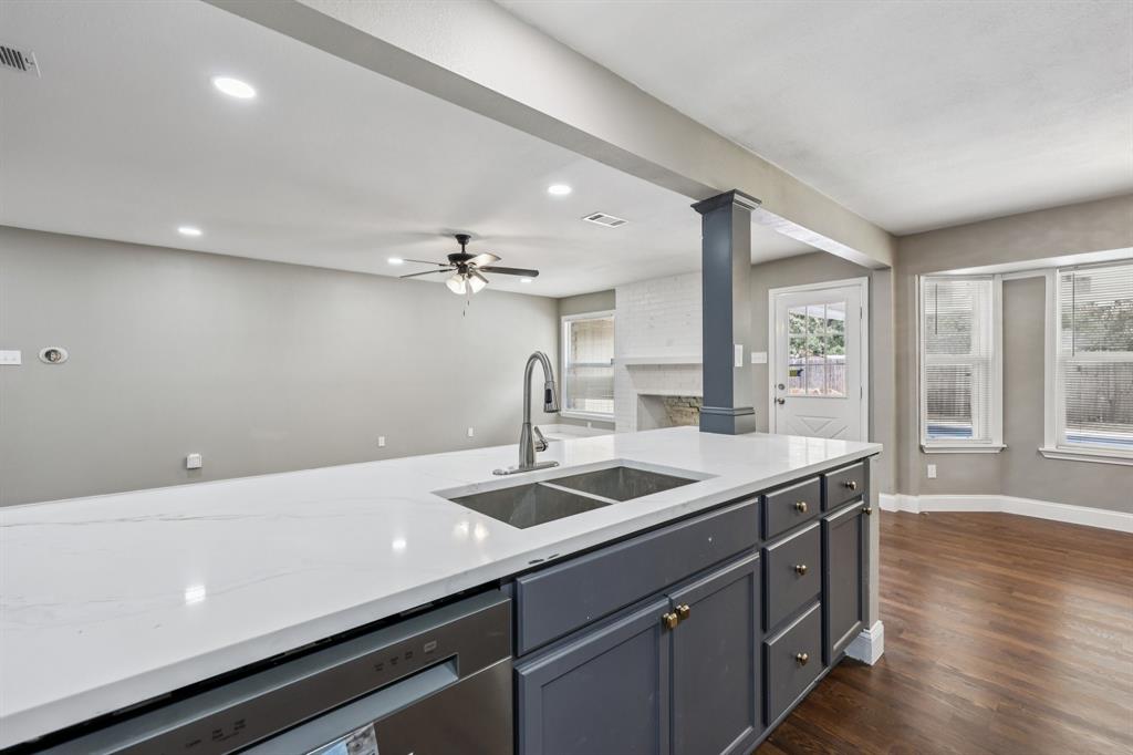 1033 Oak Ridge Drive Azle, TX 76020 - Photo 10 of 30 a kitchen with a sink and wooden floor