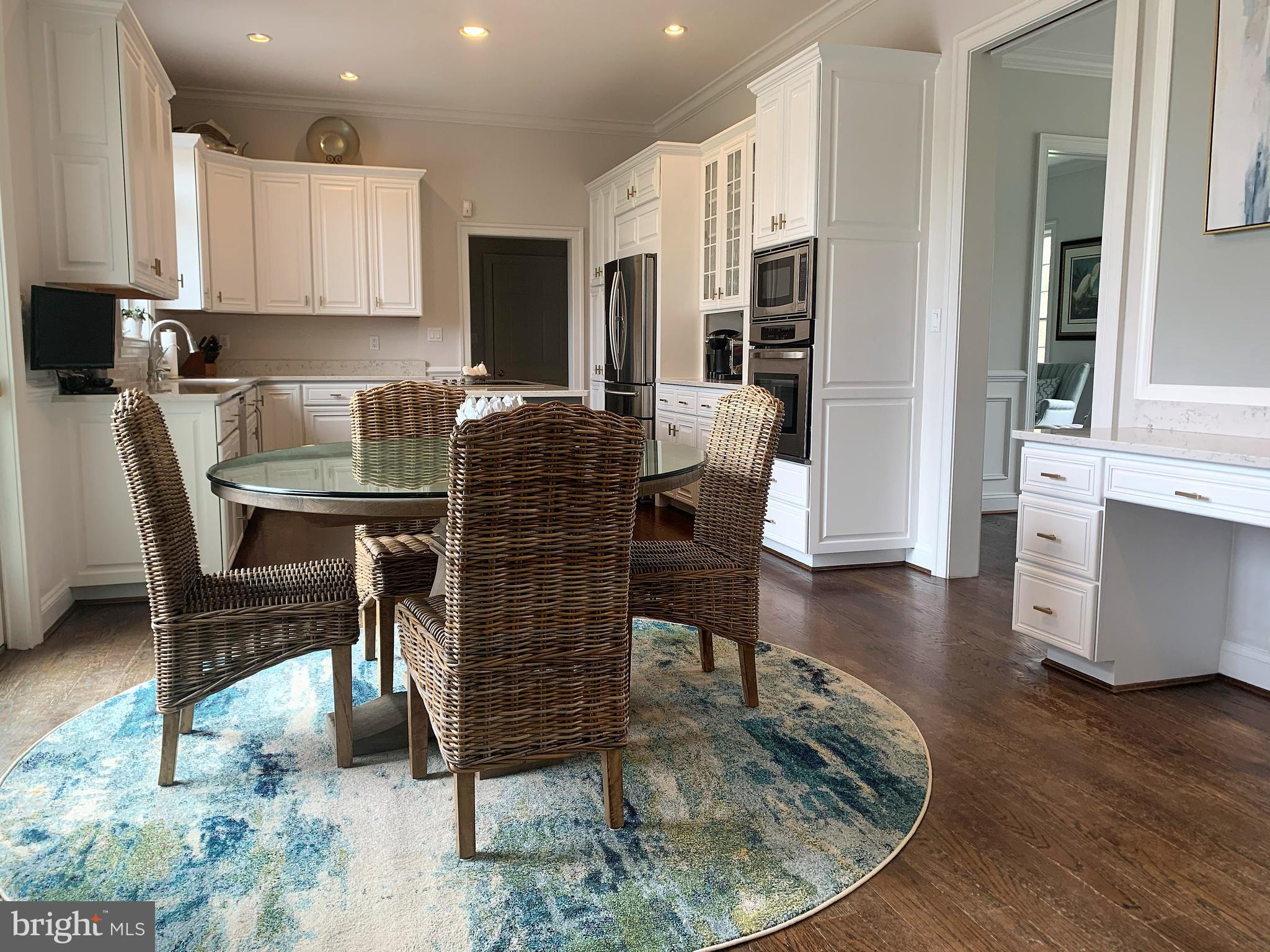 2902 Cox Neck Road East Chester, MD 21619 - Photo 12 of 57 a dining room with furniture and wooden floor