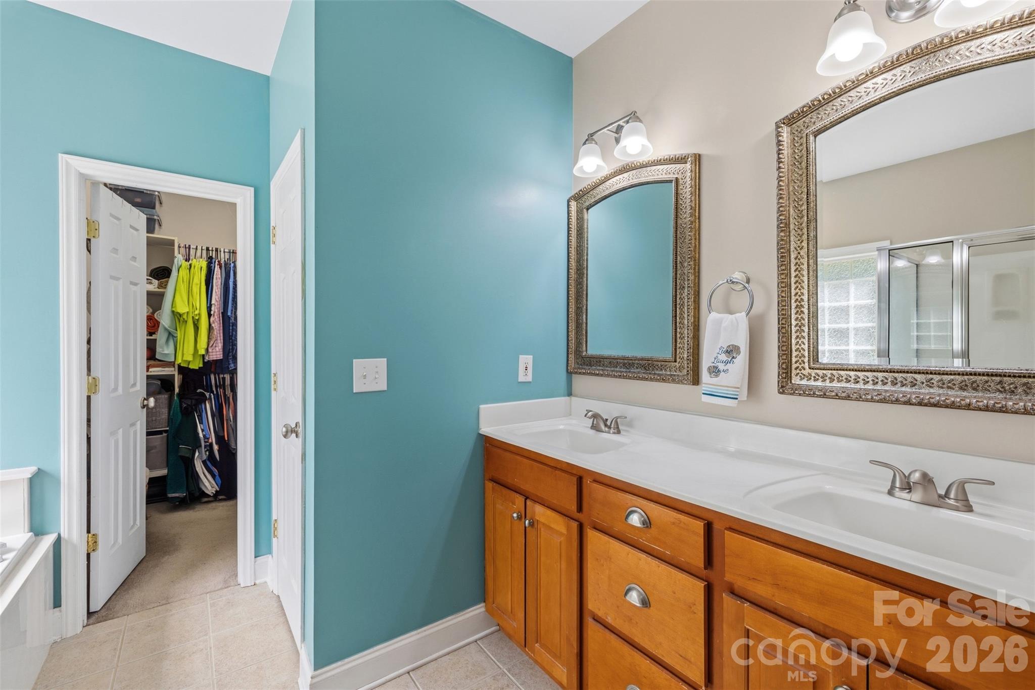 710 Sleepy Hollow Road Midland, NC 28107 - Photo 14 of 29 a spacious bathroom with a granite countertop sink and a mirror