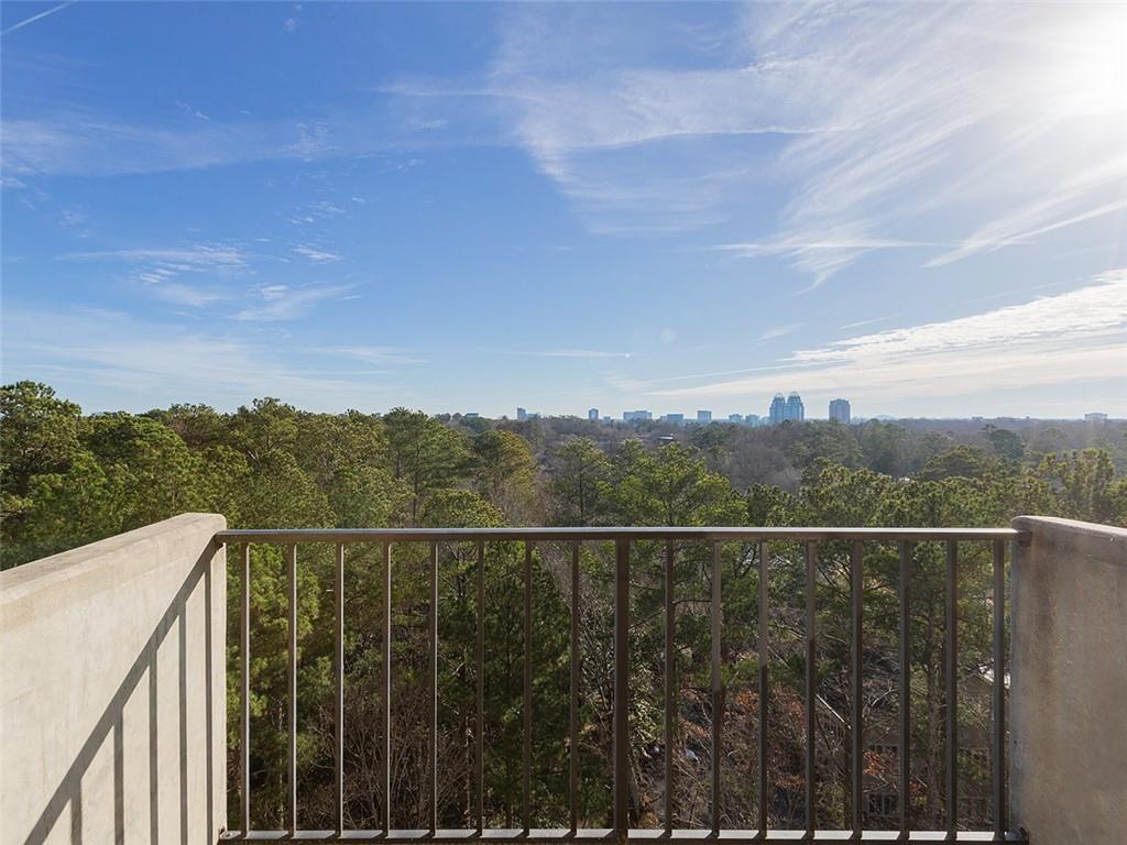 300 Johnson Ferry Road, Unit A913 Sandy Springs, GA 30328 - Photo 1 of 1 a view of a balcony with a forest