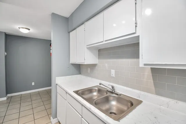 a view of swimming pool with outdoor seating and plants