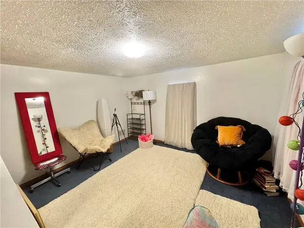 a room with furniture and air hockey table