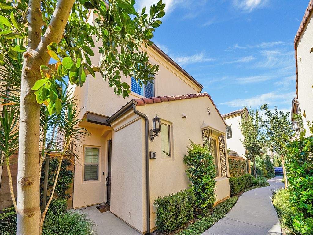 a view of a house with a tree