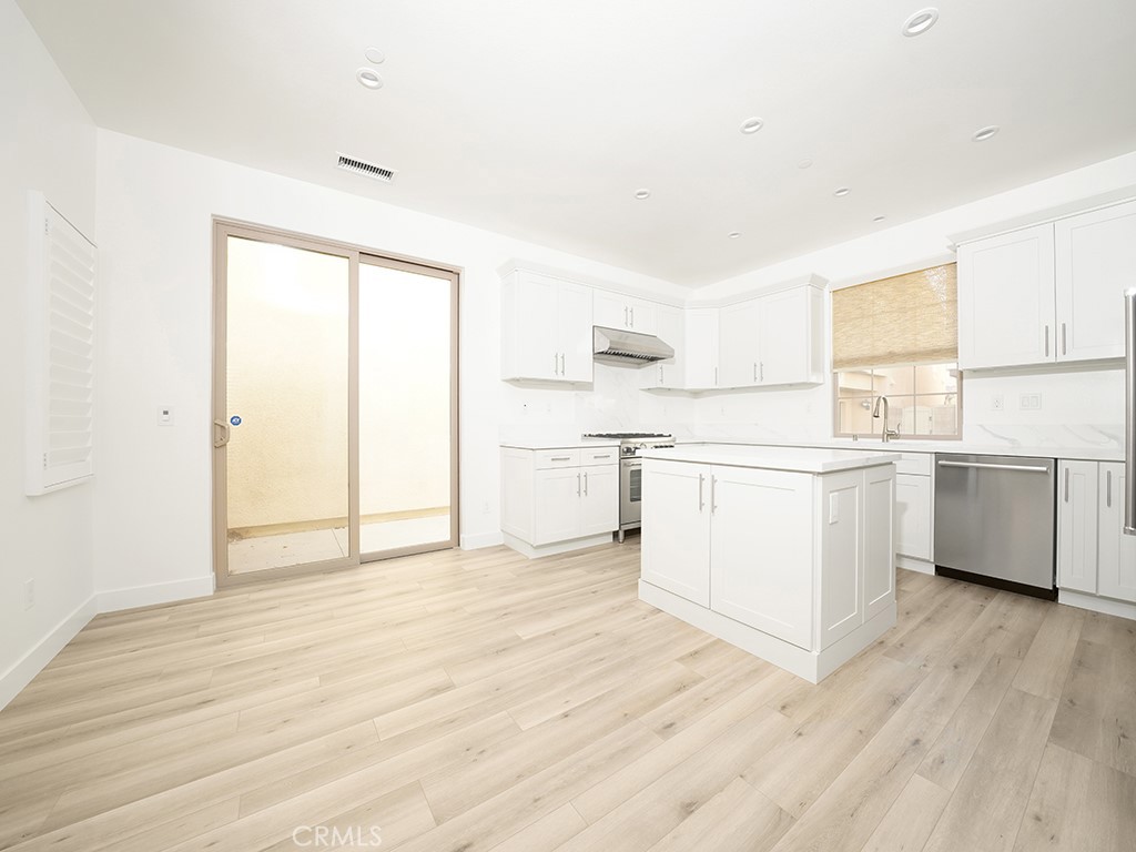120 Messenger Irvine, CA 92618 - Photo 12 of 26 a view of a kitchen with wooden floor