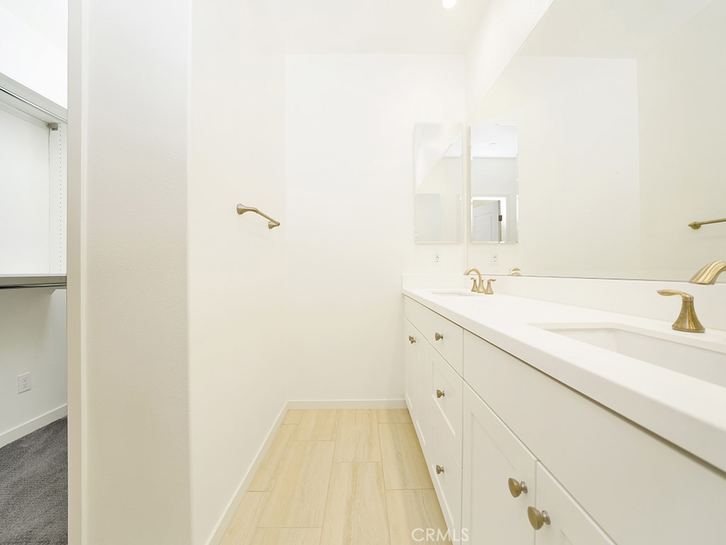 120 Messenger Irvine, CA 92618 - Photo 23 of 26 a spacious bathroom with a sink and a mirror
