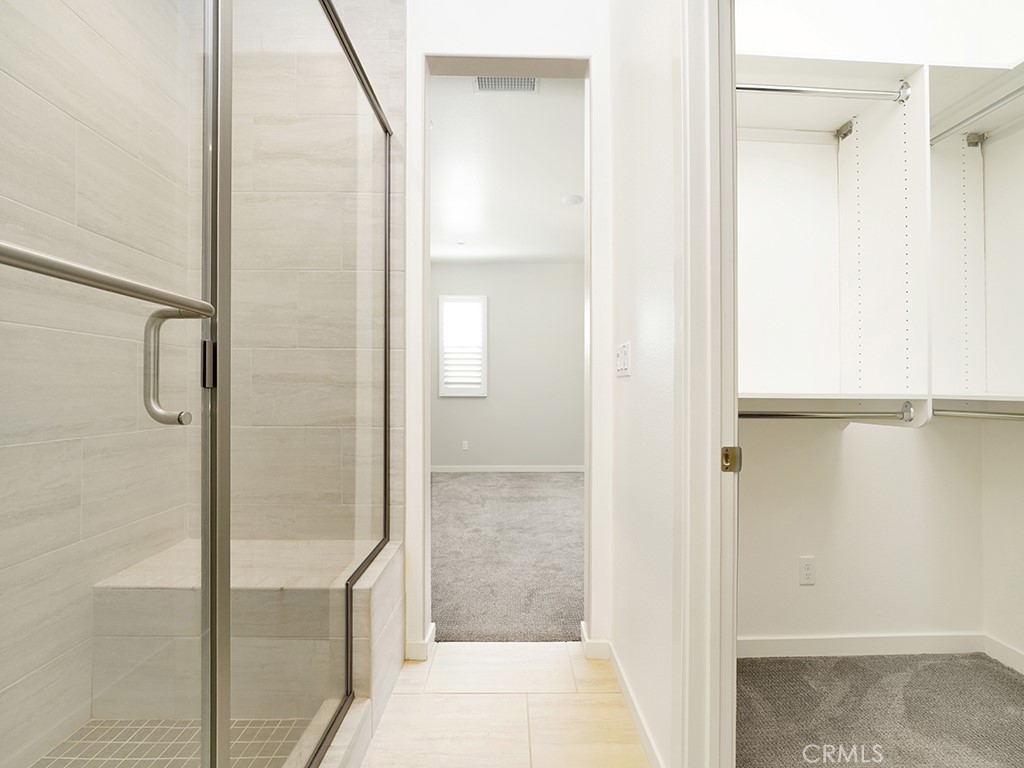 120 Messenger Irvine, CA 92618 - Photo 24 of 26 a bathroom with a glass shower door