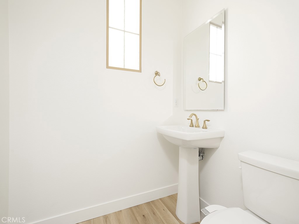 120 Messenger Irvine, CA 92618 - Photo 7 of 26 a bathroom with a sink a toilet and mirror