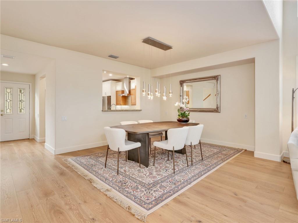 5242 Kensington High Street Naples, FL 34105 - Photo 16 of 45 The dining room is easily accessible to the kitchen