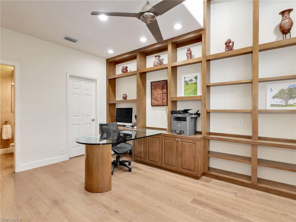 5242 Kensington High Street Naples, FL 34105 - Photo 9 of 45 A custom office with walk in closet and access to the powder bath