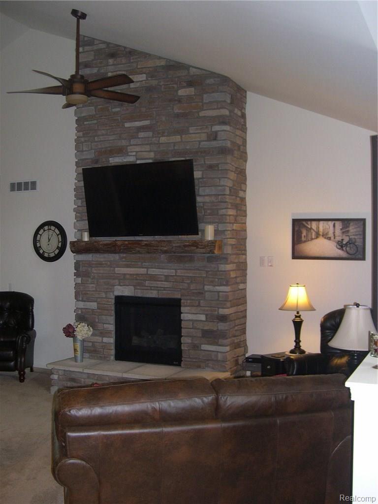 4170 Elevation Lane Howell, MI 48855 - Photo 16 of 36 FULL BRICK WALL GAS FIREPLACE