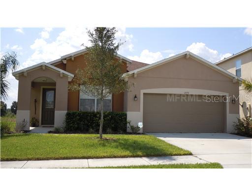 1773 Strathmore Circle Mount Dora, FL 32757 - Photo 1 of 1 a front view of a house with a yard