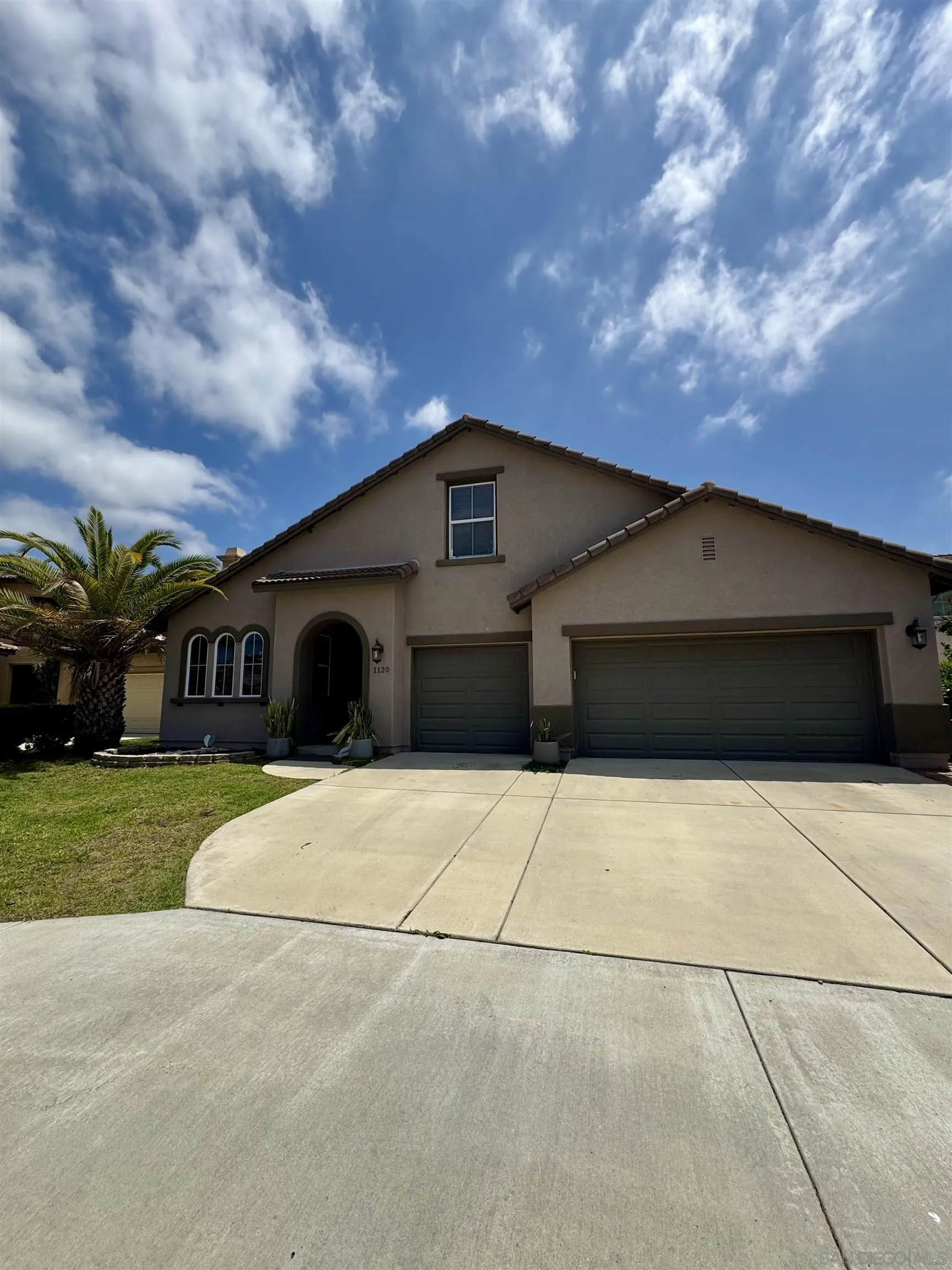 1120 Parkview Drive Oceanside, CA 92057 - Photo 1 of 8 a front view of a house with garden