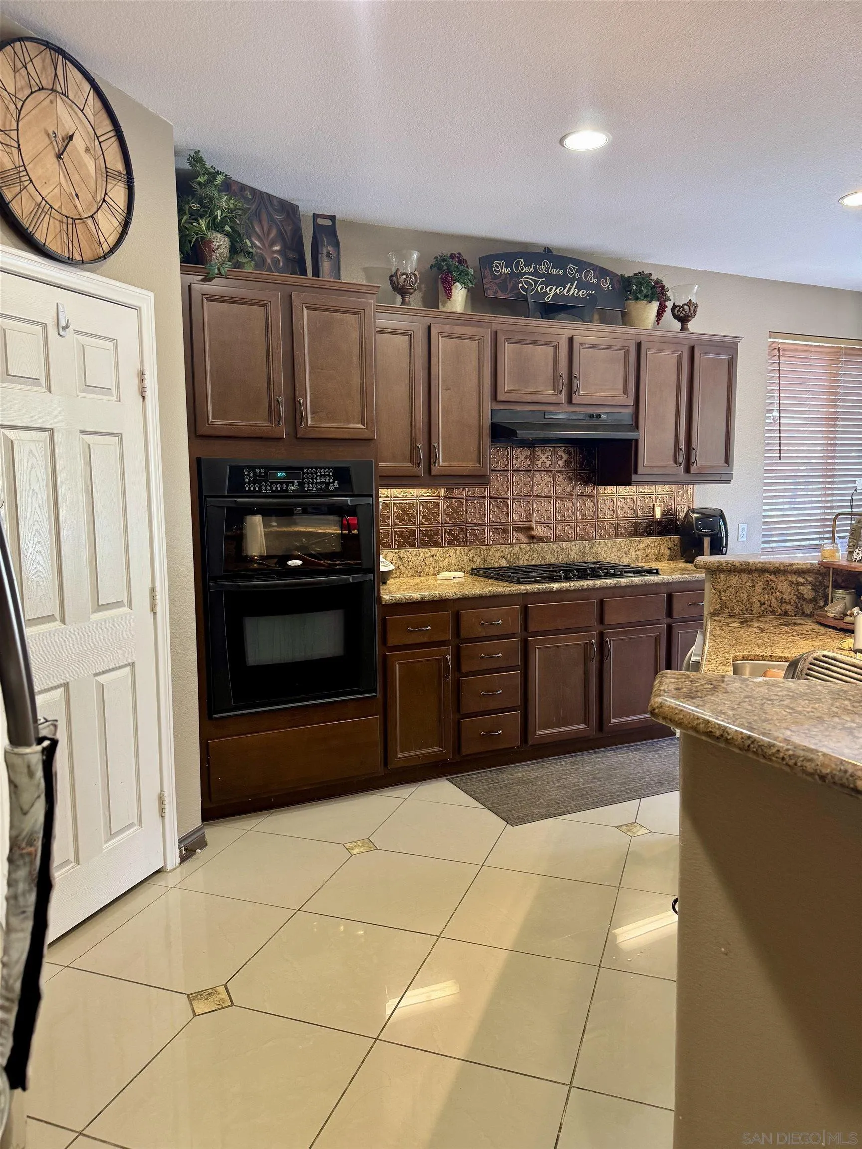 1120 Parkview Drive Oceanside, CA 92057 - Photo 2 of 8 a kitchen with stainless steel appliances granite countertop a stove top oven a sink and a refrigerator
