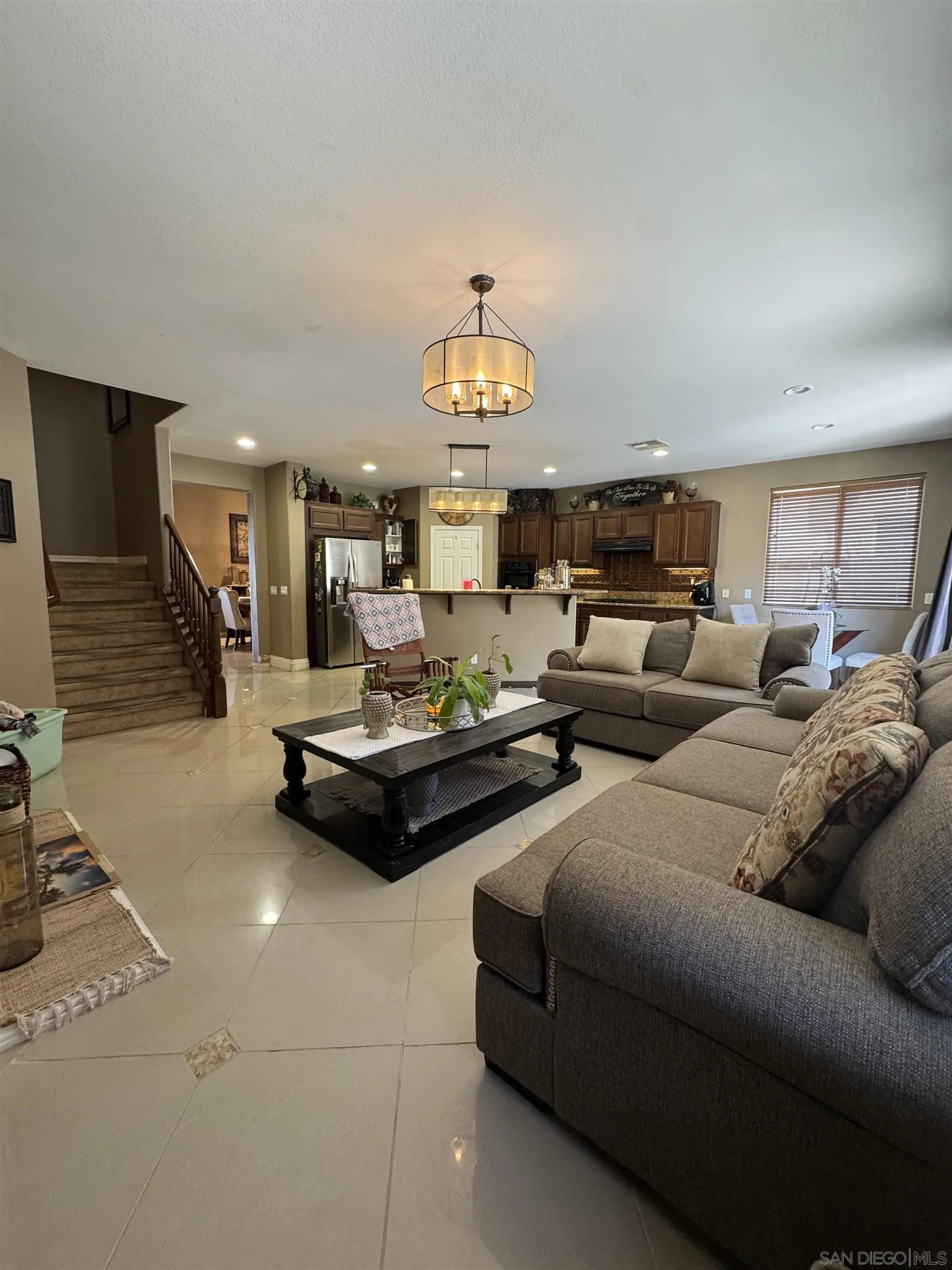 1120 Parkview Drive Oceanside, CA 92057 - Photo 3 of 8 a living room with furniture and a chandelier