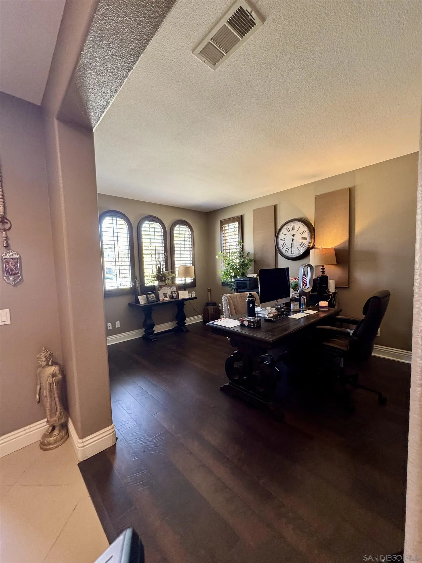 1120 Parkview Drive Oceanside, CA 92057 - Photo 8 of 8 a living room with furniture a mirror and wooden floor