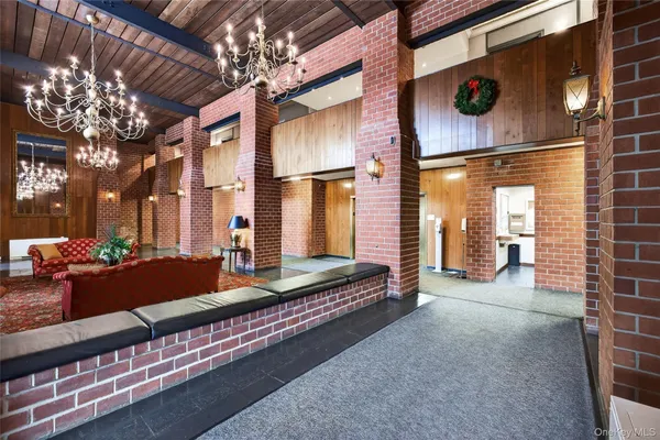 a living room with furniture and large windows