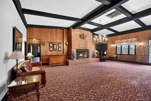 a large white kitchen with a large window
