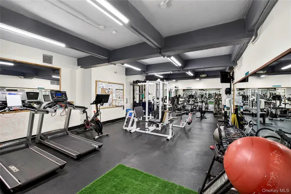 a spacious bathroom with a white tub