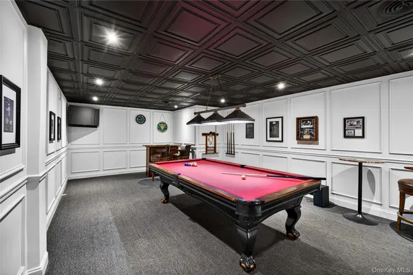 a room with furniture and air hockey table