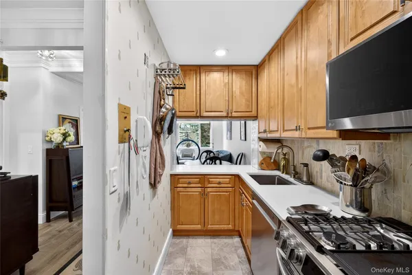 a kitchen with a sink stove and refrigerator