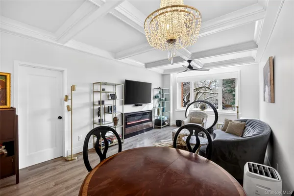 a view of a livingroom with furniture and a dining room