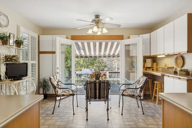 a view of a dining room with furniture window and outside view
