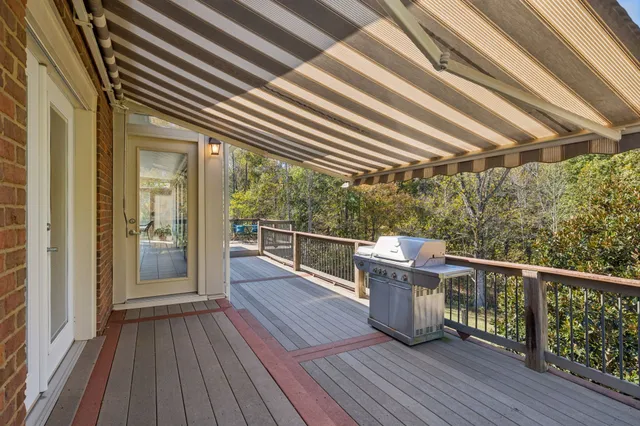 a view of a balcony with wooden floor