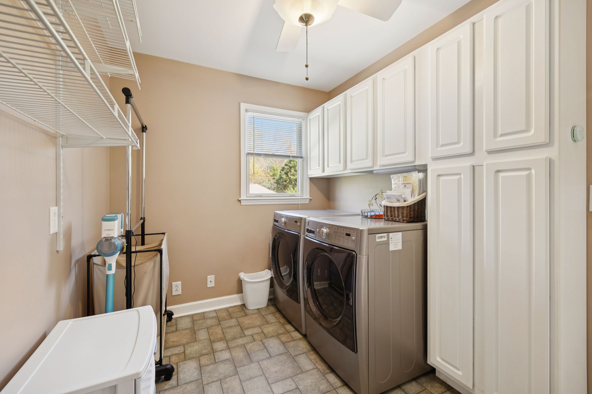 7875 Oscar Green Road Primm Springs, TN 38476 - Photo 20 of 44 a utility room with cabinets washer and dryer