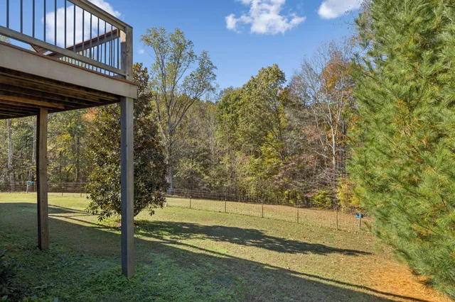 a view of a playground with a house