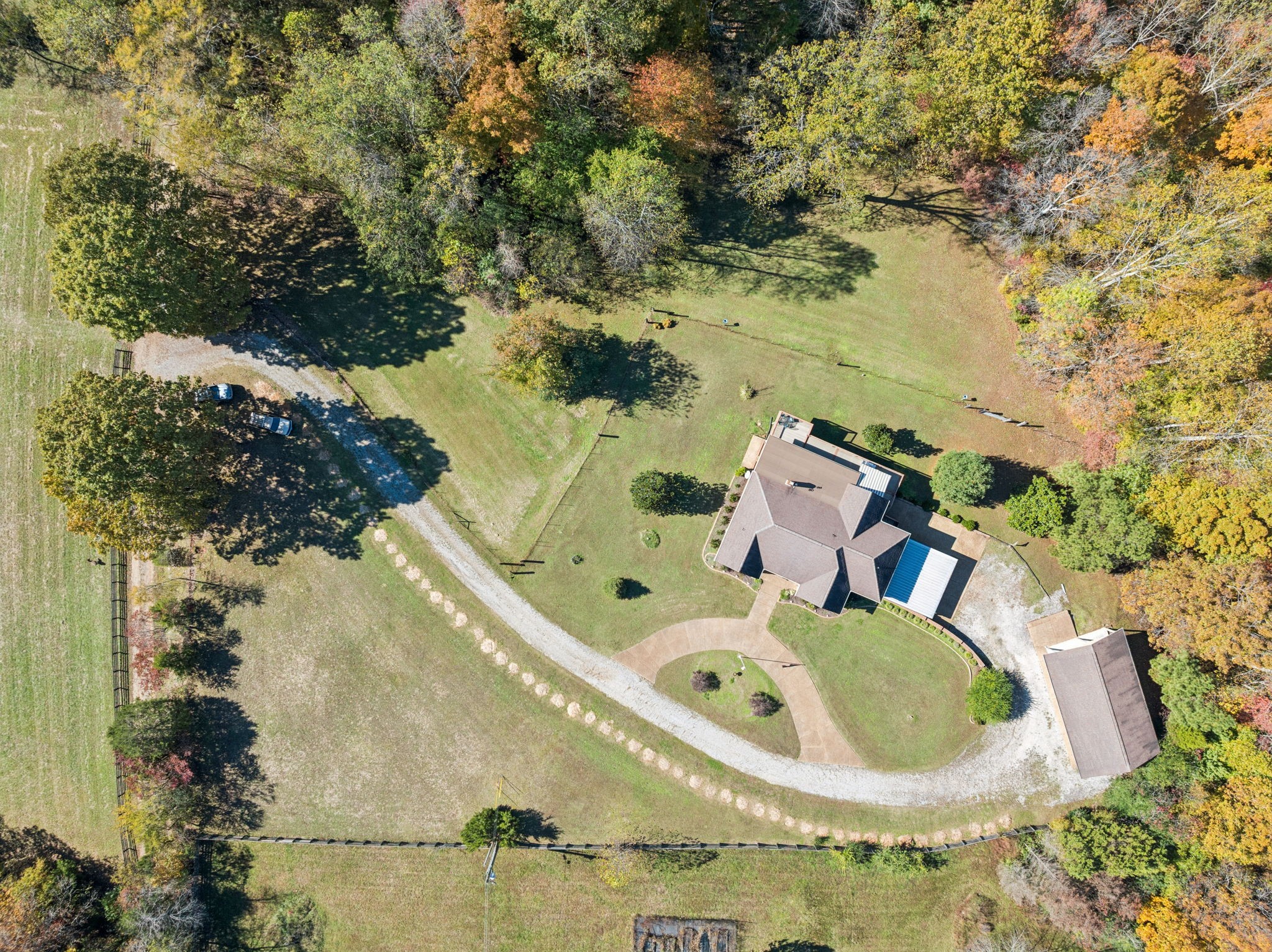 7875 Oscar Green Road Primm Springs, TN 38476 - Photo 36 of 44 an aerial view of a house with a yard and large trees