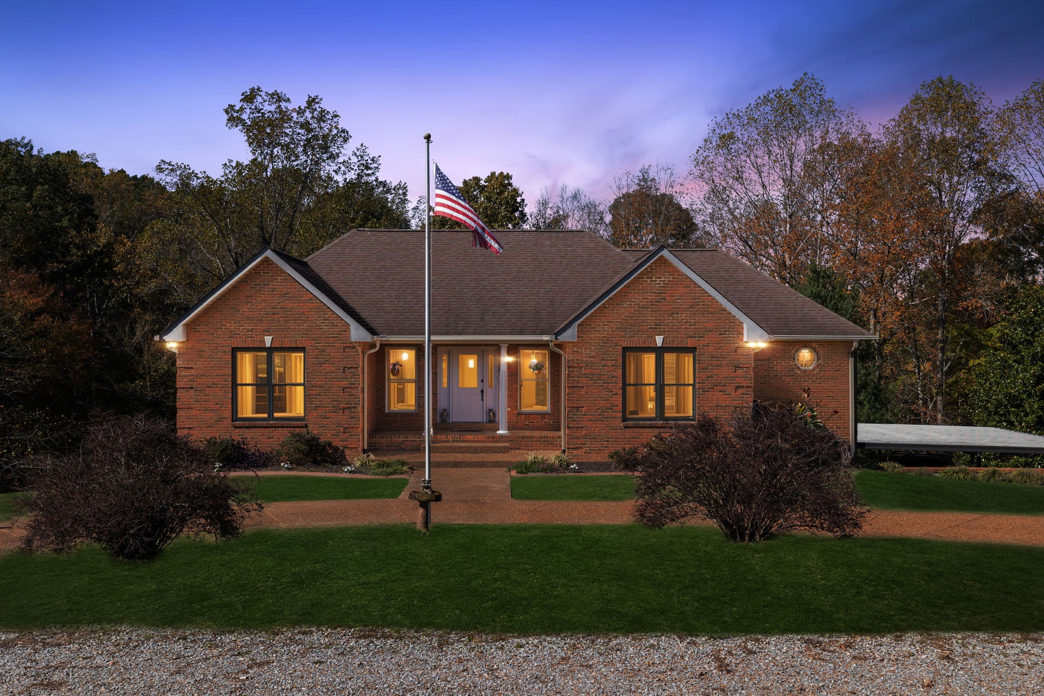 7875 Oscar Green Road Primm Springs, TN 38476 - Photo 40 of 44 a front view of a house with a yard and garage