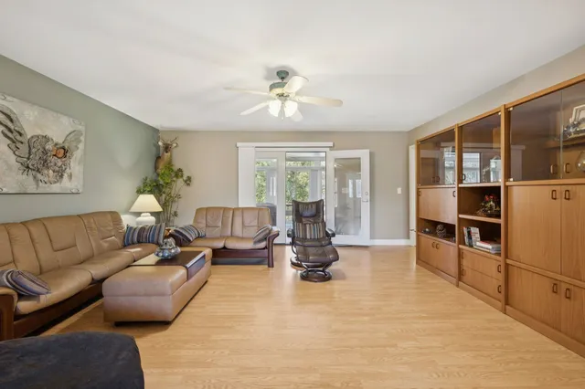 a living room with furniture fireplace and flat screen tv