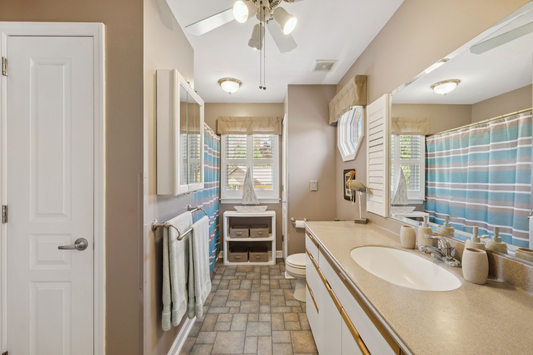 7875 Oscar Green Road Primm Springs, TN 38476 - Photo 9 of 44 a spacious bathroom with a double vanity sink a mirror and a shower