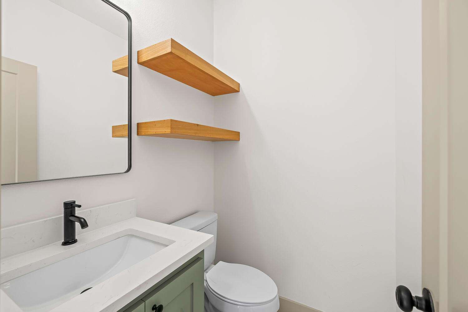 8412 North County Road 1300 Shallowater, TX 79363 - Photo 13 of 43 a bathroom with a sink vanity mirror and toilet