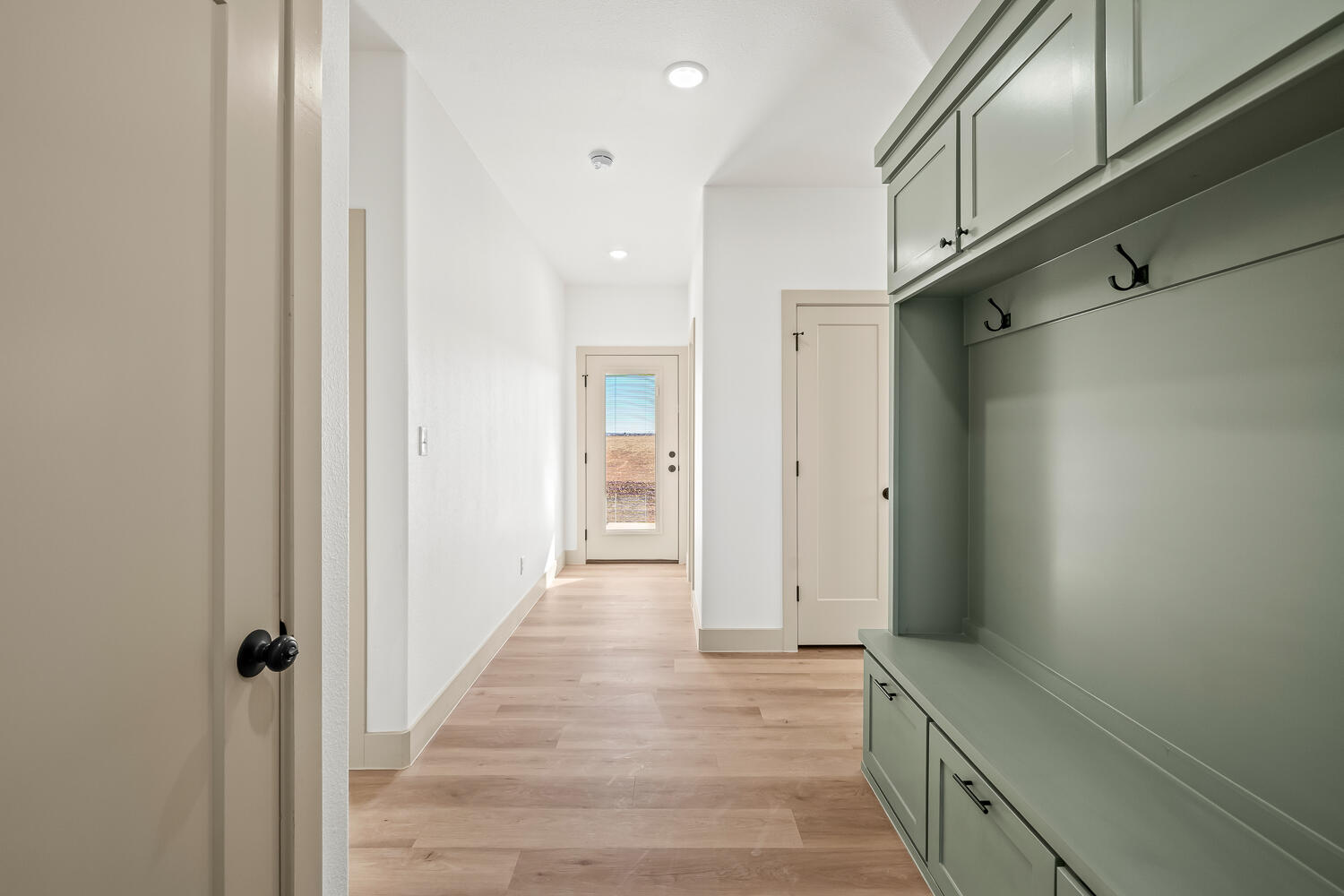 8412 North County Road 1300 Shallowater, TX 79363 - Photo 15 of 43 a view of a hallway with wooden floor and staircase