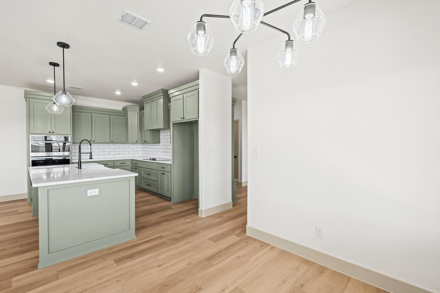 8412 North County Road 1300 Shallowater, TX 79363 - Photo 17 of 43 a kitchen with a sink stainless steel appliances wooden floor and view living room