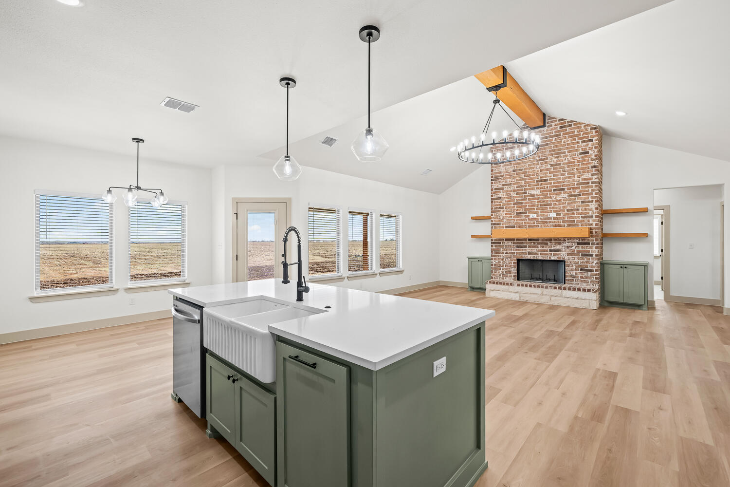 8412 North County Road 1300 Shallowater, TX 79363 - Photo 19 of 43 a kitchen with a sink a stove and a wooden floor