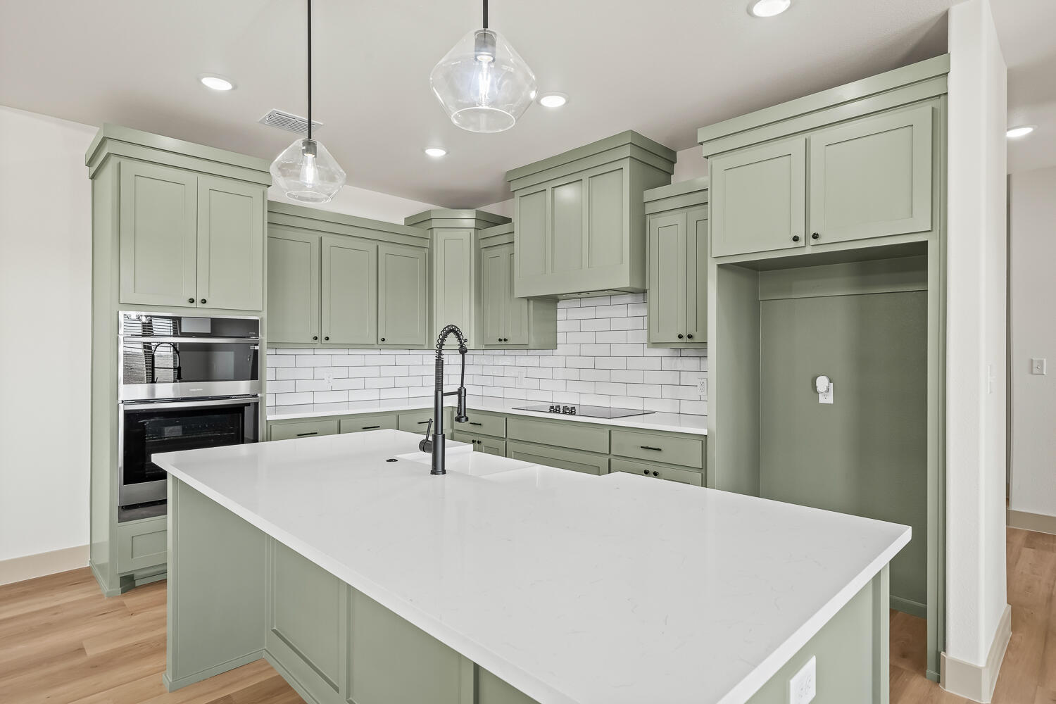 8412 North County Road 1300 Shallowater, TX 79363 - Photo 22 of 43 a kitchen with kitchen island a sink appliances and cabinets