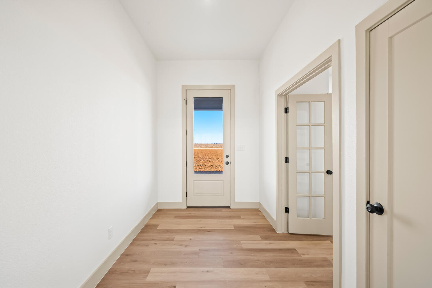 8412 North County Road 1300 Shallowater, TX 79363 - Photo 28 of 43 a view of a hallway with wooden floor and entryway