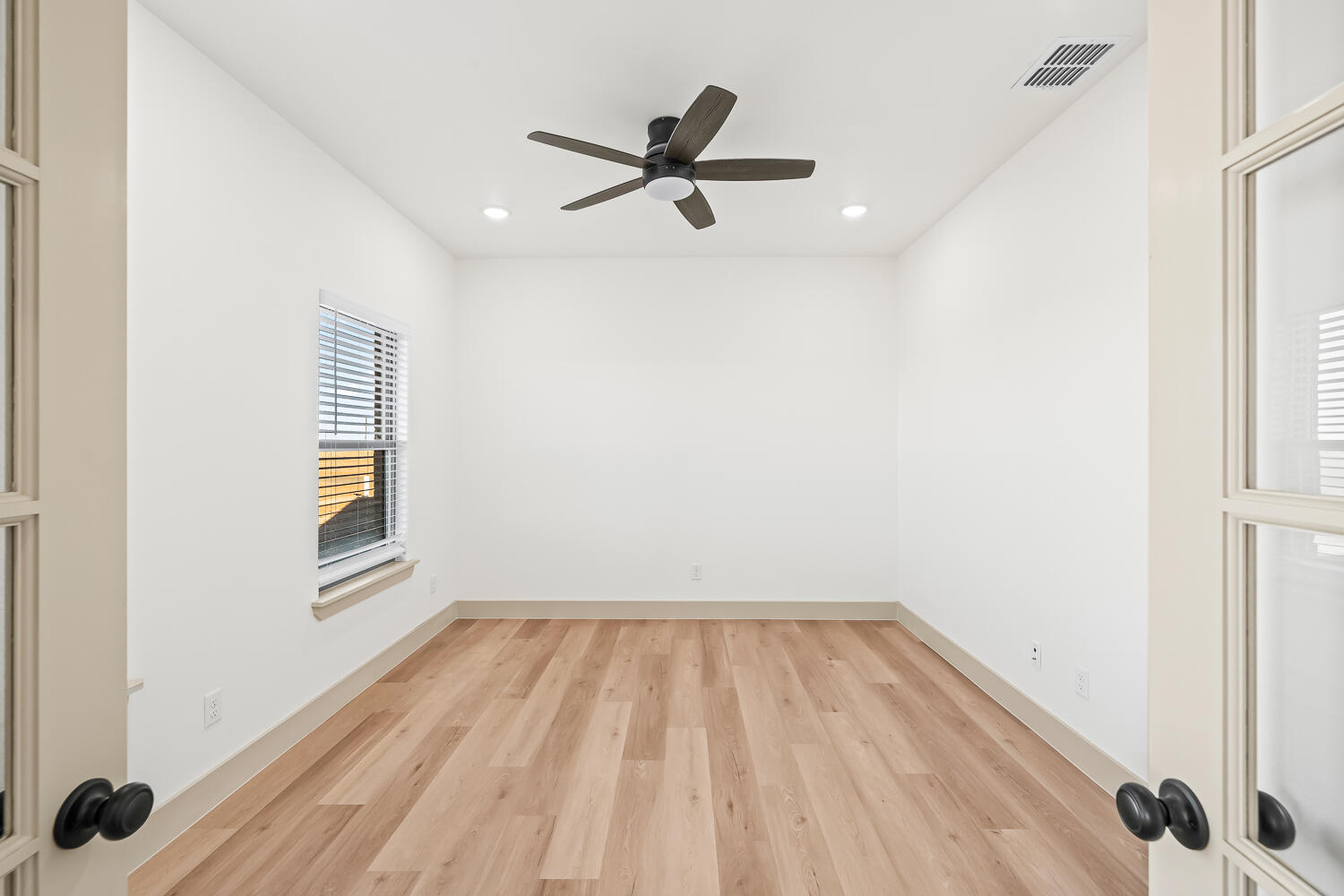 8412 North County Road 1300 Shallowater, TX 79363 - Photo 29 of 43 a view of empty room with wooden floor