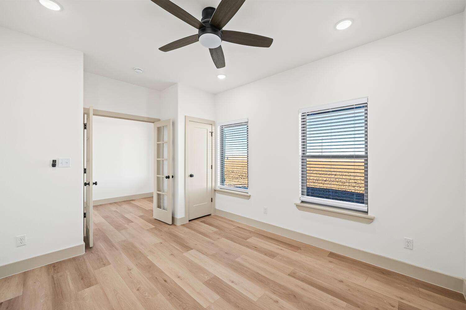 8412 North County Road 1300 Shallowater, TX 79363 - Photo 30 of 43 an empty room with wooden floor and windows