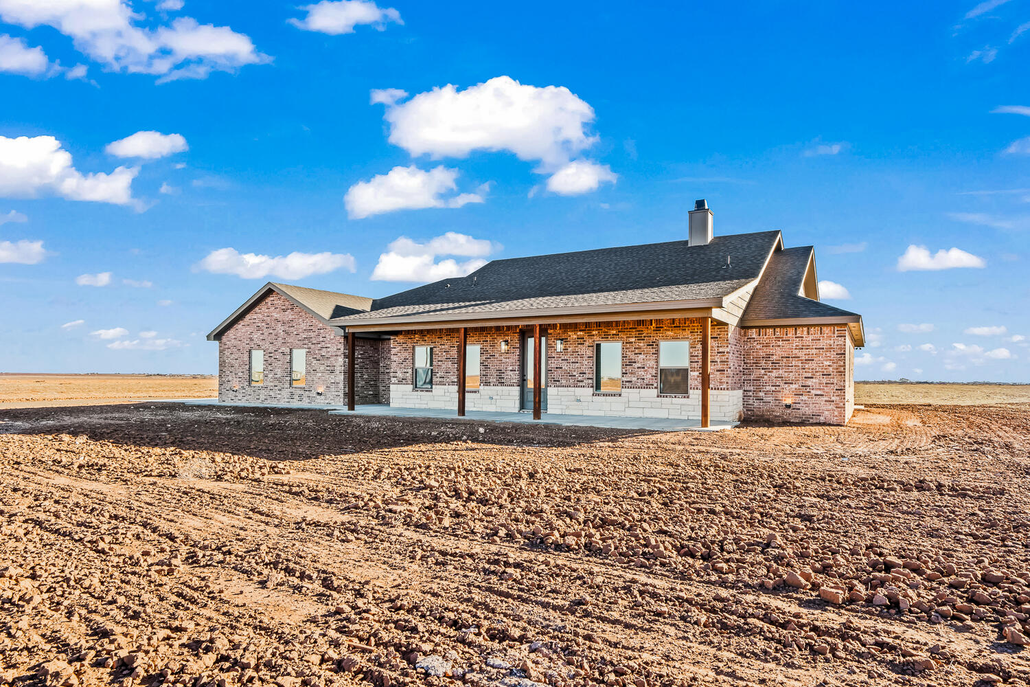 8412 North County Road 1300 Shallowater, TX 79363 - Photo 3 of 43 a front view of a house with a yard